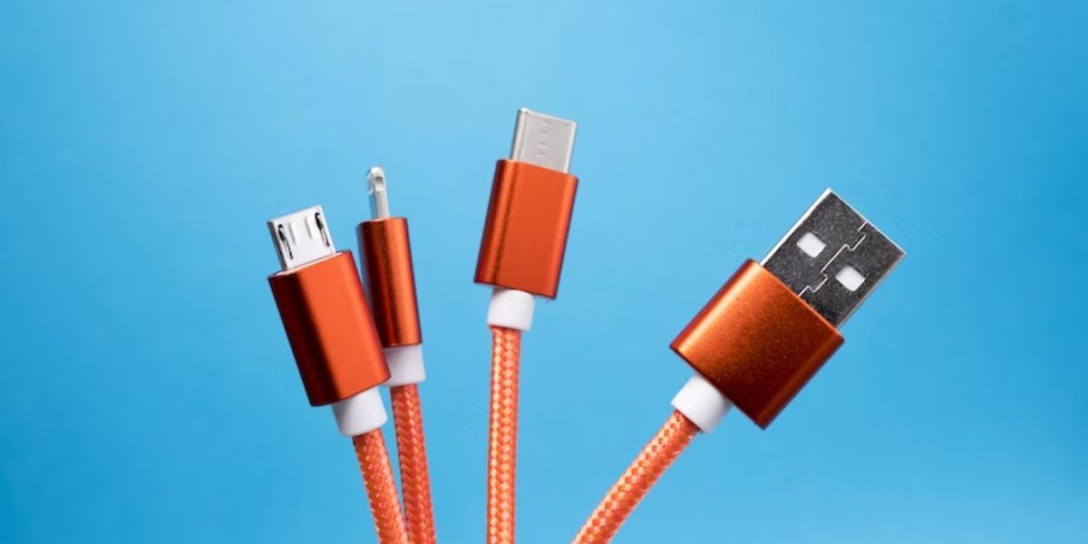 orange lightning and usb cable against blue background